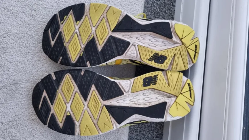 A pair of worn running shoes, highlighting the need for timely replacements