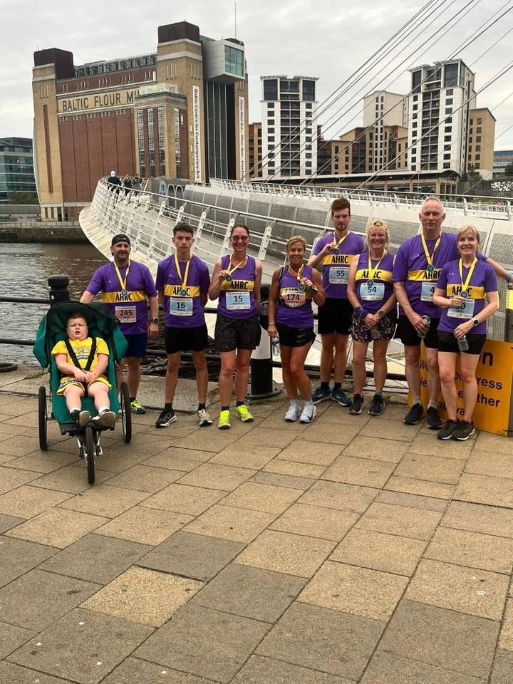AHRC runners gather at the Sunshine Run with a specialist buggy